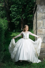 Obraz na płótnie Canvas small girl in white dress outdoor