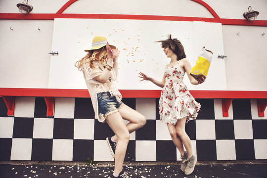 Caucasian Friends Having Popcorn Fight Outdoors