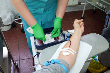 doctor marks a package into which donor donates blood