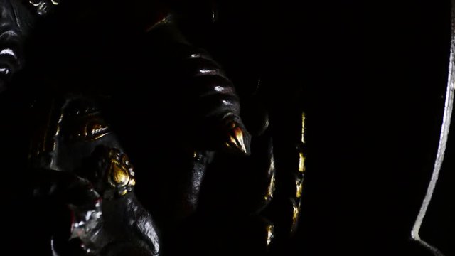 Ganesha statue hindu gyrating at black background