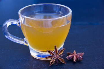 Herbal tea with star anise on a slate floor