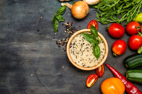 Wild Rice  And Vegetables  For Tasty Cooking On Rustic Wooden Background, Top View.