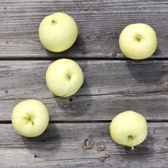  appetizing fruit harvest/ flat layout of apples scattered on an old wooden surface top view 