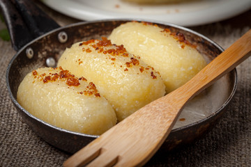 Potato dumplings stuffed with minced meat.