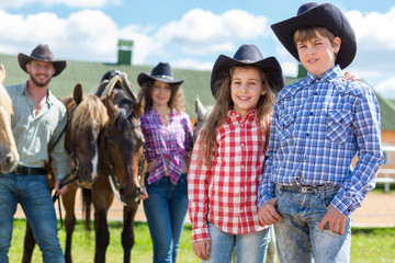 cowboy brother and sister closeup portrait