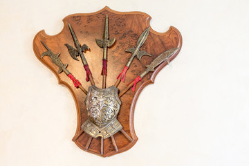 Decorative halberds and armor on the wall