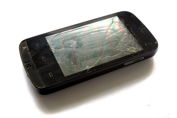 Broken smartphone - cell phone on white background.