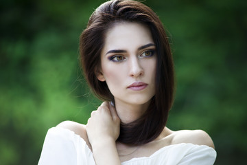 Close-up portrait of a beautiful young caucasian woman with clean skin, long hair and casual makeup