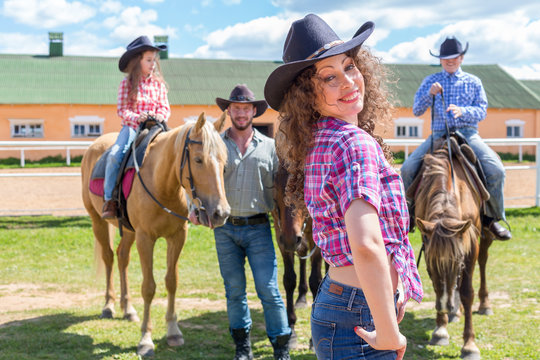 cowboy woman with husband and children