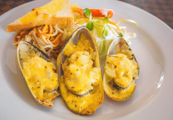 New Zealand mussels baked with cheese