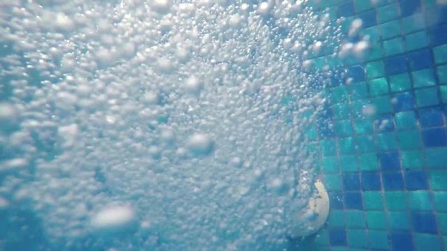 underwater bubbles from pool water jet filling hose, thermal spa 