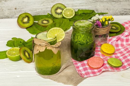 green smoothie in a jar with lime and berries