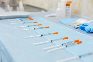 row of syringes with medicines