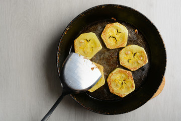 Fried courgette in the pan