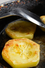 Fried courgette in the pan