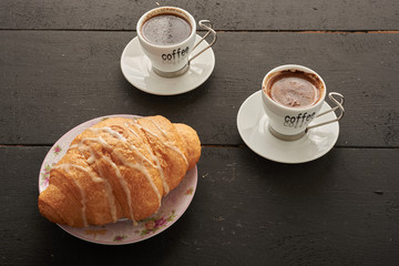 two coffee and croissant