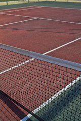 Tennis field with red and white lines