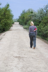 Fototapeta na wymiar Woman Walking Barefoot
