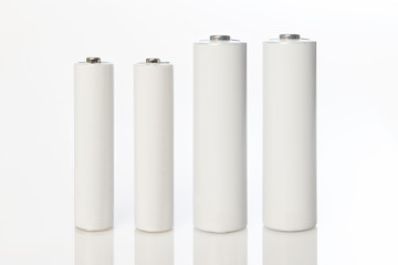 white aa and aaa batteries on white background