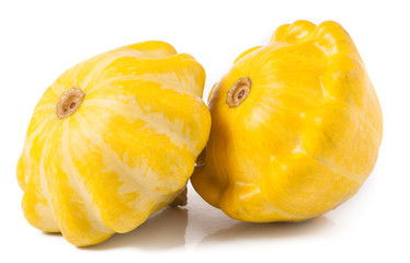 two yellow pattypan squash isolated on white background