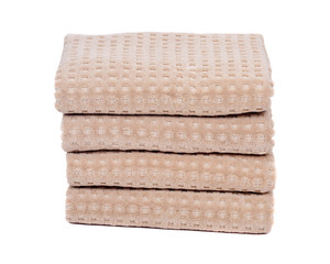 Organic cotton folded bath towels separated on white background