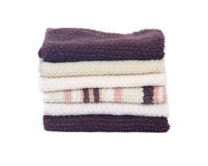 Organic cotton folded bath towels separated on white background