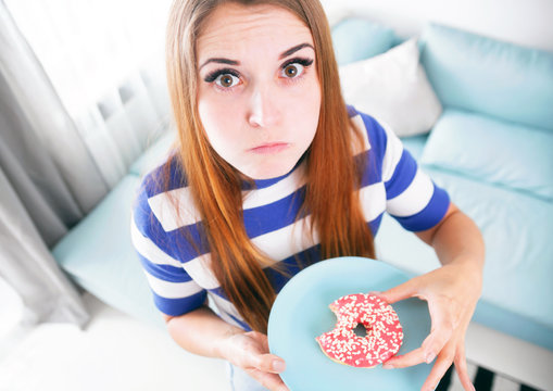 Woman on diet caught during eating donut