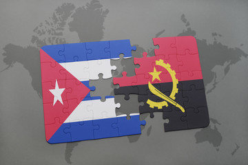 puzzle with the national flag of cuba and angola on a world map background.