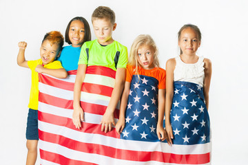 Group of school children holding american national flag