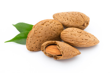 Almonds with leaves isolated on white background