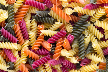 Closeup of raw eco macaroni pasta background.