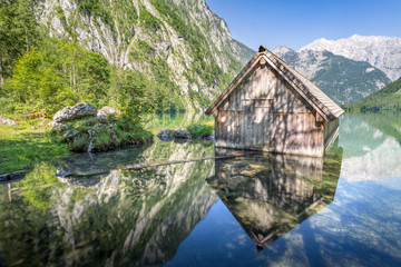 Fototapeta na wymiar Wooden boat hut at the Obersee, Koenigssee, Bavaria, Germany