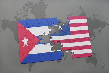 puzzle with the national flag of cuba and liberia on a world map background.