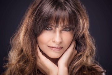 Beauty portrait of natural brunette woman.