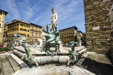 Fototapeta na wymiar The Fountain of Neptune in a summer day in Florence, Italy