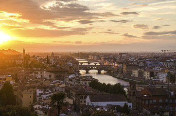Fototapeta na wymiar Bridges of Florence over the Arno River at sunset, Italy