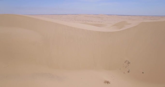 Desert Sand Dune Reveal / Multiple clips of endless desert sand dunes.