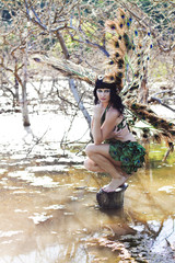 Fototapeta premium girl bird in the Green swamp