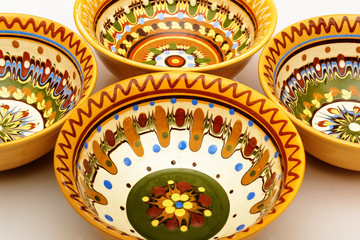Traditional colored pottery. Painted ceramic crockery.