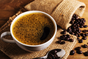 Coffee cup with coffee bean in still life
