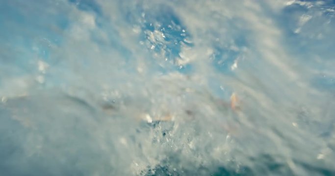 Beautiful young woman kiteboarding at sunset in slow motion, active lifestyle extreme sport