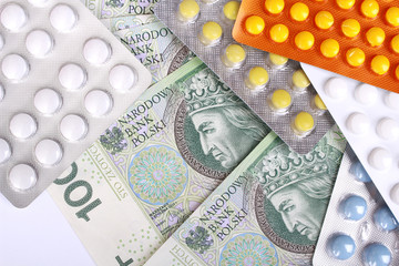 Zloty money bills and colorful pills
