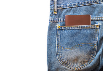 Passport or blank note book in blue jeans pocket on white isolated background. copy space for text