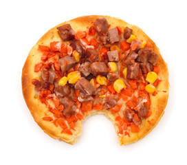 top view pizza with meat maize and carrot with a bite on white background