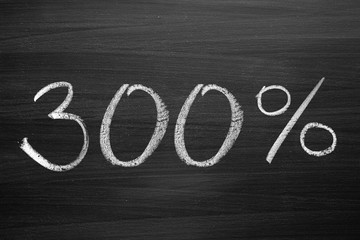 200-percent title written with a chalk on the blackboard
