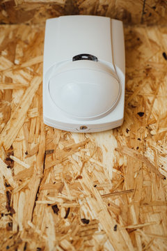 motion detector (sensor) in action, osb wall background