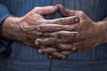 Close up of mechanic's dirty hands