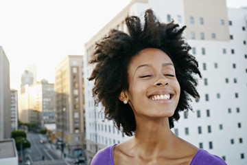 Mixed race woman on urban rooftop