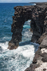 Natural arch along the lava coast in Big Island, Hawaii
