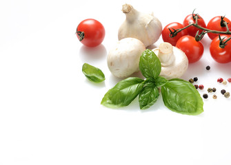 fresh basil, mushrooms, garlic and cherry tomatoes on a white background